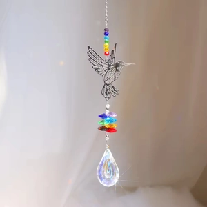 Detail of hummingbird suncatcher with rainbow beads and faceted crystal teardrop