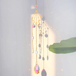 Detailed close-up of suncatcher featuring star and moon charms with AB crystal prisms