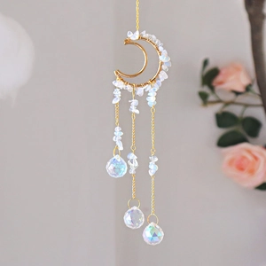Detail of moon suncatcher with moonstone chips and multifaceted crystal spheres