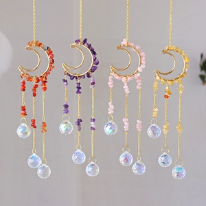 Set of four moon-shaped suncatchers with handmade colorful crystal stones and prisms
