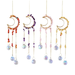 Set of four moon-shaped crystal suncatchers with metal frames and polished glass prisms