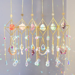 Golden sun catcher pendants with natural crystals and geometric metal frames for garden decor
