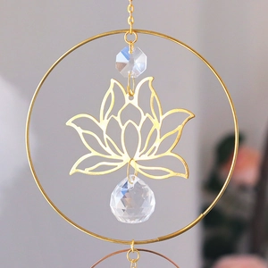 Close-up of golden lotus crystal suncatcher with AB colorful faceted glass sphere