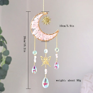 Detail view of pink crystal suncatcher with moon frame and dimensions 26cm by 10cm