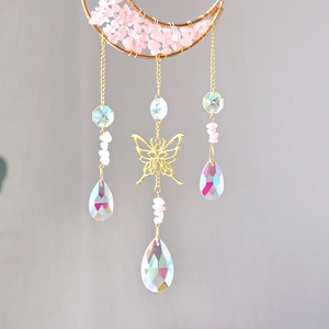 Pink crystal suncatcher with golden moon and butterfly prism drops for garden decor
