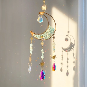 Detail of moon sun crystal hanging ornament with aventurine stone and rainbow prisms