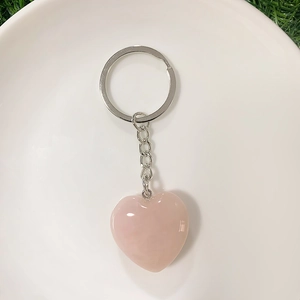 Handcrafted rose quartz heart keychain with polished crystal and silver metal ring