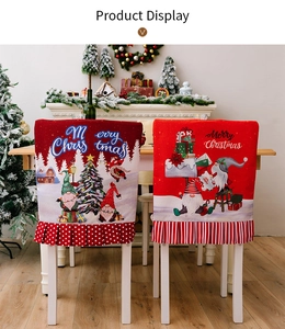 Detail of red Christmas chair covers with festive gnome prints and ruffled edges