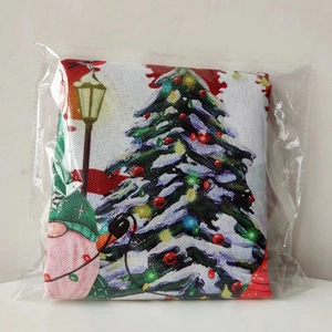 Detail of Christmas chair cover fabric with gnome and tree print in festive red