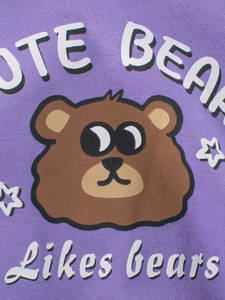 Close-up of purple kids fleece sweatshirt featuring a cute cartoon bear print and UTE BEAR text