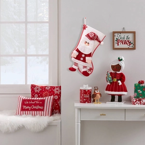 Detail of plush Christmas stocking with 3D Santa and snowflake embroidery decor
