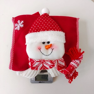 Detail view of a snowman gift bag showing red knit hat and weight of 108.2 grams