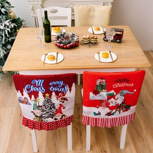 Christmas chair back covers with festive Santa and tree prints and ruffled edges