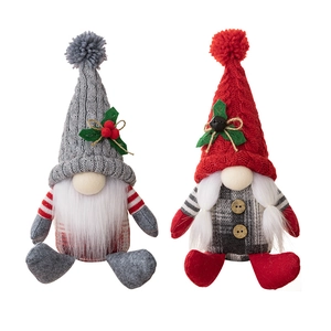 Pair of sitting Christmas gnomes with knitted tall hats and checkered plaid bodies