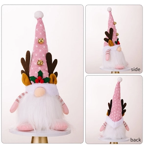 Vue triple d'un gnome de Noël rose avec cloches dorées, bois de renne et longue barbe