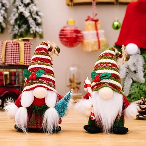 Detail of Christmas gnomes with striped hats holding a tree and candy cane in festive scene
