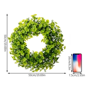 50cm St. Patrick's Day green leaf wreath size comparison with phone on white background