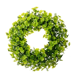 Lush green shamrock wreath for St. Patrick's Day door decoration on white background