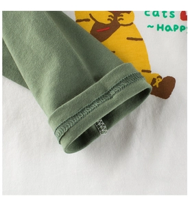 Detail of ribbed cuffs and high-quality stitching on long sleeve cotton baby shirt