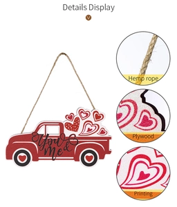 Detail showing red truck wood pendant with You & Me text and plywood texture