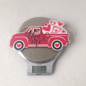 Weight measurement of red wooden truck hanging ornament with heart-shaped decor