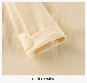 Close-up of beige long sleeve t-shirt cuff showing high-quality double stitching detail