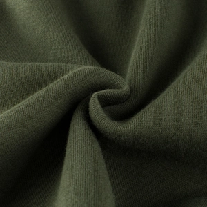 Macro shot of dark green fleece-lined knit fabric texture for kids sweatshirt