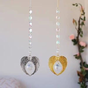 Macro shot of silver and gold heart suncatchers with crystal balls and colorful beads