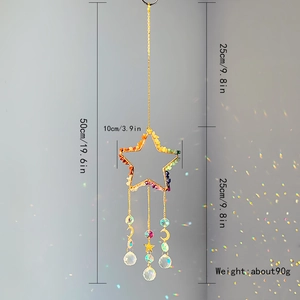 Close-up of golden star suncatcher with natural crushed stones and crystal ball prism