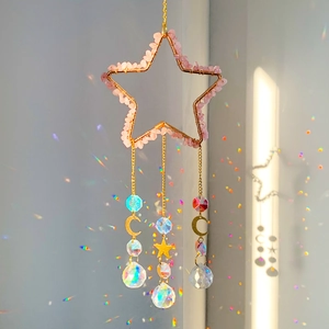 Pink natural crushed stone pentagram suncatcher with crystal prisms reflecting rainbow light