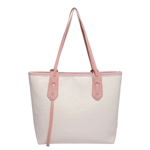 Grand sac cabas bicolore rose et beige avec motifs embossés et fines bandoulières