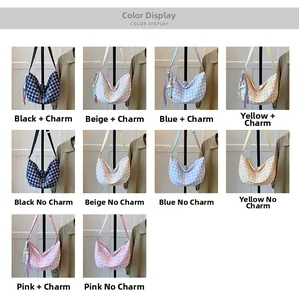 Detail view of plaid canvas crossbody bags showing varied colors and embroidery patterns