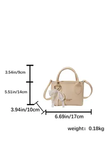 Yellow square bucket bag with dimensions and pearl pendant detail for stylish commuting