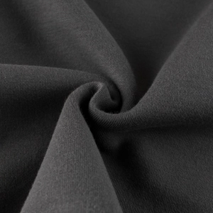 Detailed macro shot of dark grey fleece-lined knit fabric texture for kids sweatshirt