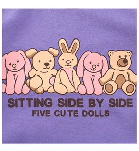 Detail of purple children hoodie fabric showing colorful cartoon animal prints and text