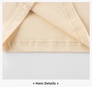 Détail du double ourlet à l'aiguille sur le bas d'un t-shirt en coton de couleur beige