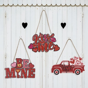 Three-piece Valentine's Day heart wooden ornaments with Kiss Me and Be Mine text on white wood
