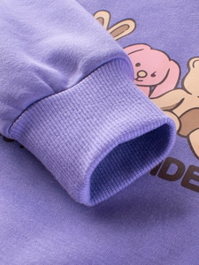 Close-up of purple fleece sweatshirt with ribbed cuffs and cute animal prints