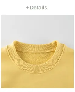 Detail of yellow sweatshirt crewneck with ribbed collar and warm fleece lining texture