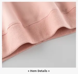 Detail view of the pink polar fleece sweatshirt showing ribbed hem and quality stitching