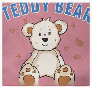 Detail shot of cute teddy bear print and XOXO embroidery on pink fleece sweatshirt