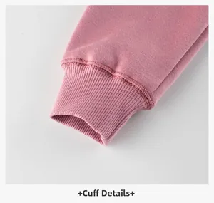 Detail of ribbed cuffs on dusty pink fleece sweatshirt for kids with high-quality stitching