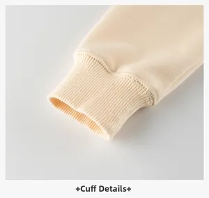Close-up of cream ribbed cuffs on a high-quality children sweatshirt for girls