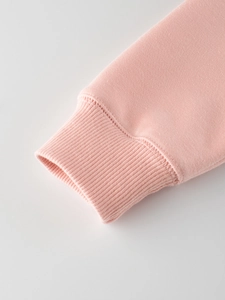 Pink fleece sweatshirt for girls featuring durable ribbed cuffs and premium stitching details
