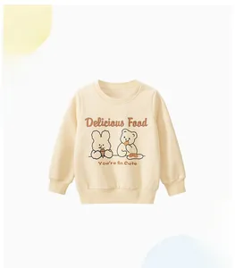 Detail of cream fleece sweatshirt featuring cute rabbit and bear cartoon prints