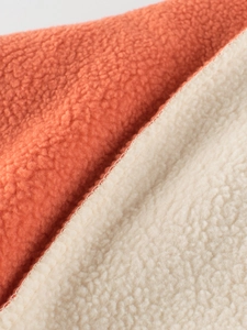 Kids warm sherpa fleece sweatshirt in orange and beige color block texture detail