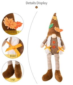 Detail view of Thanksgiving gnome with maple leaf hat and striped knit legs