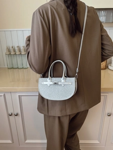 Silver glitter saddle handbag for women with metallic lock and crossbody strap