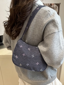 Blue denim shoulder bag with colorful mini bow embroidery and zipper closure for women