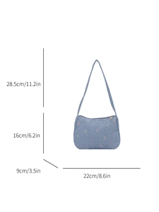 Denim shoulder bag with colorful bow embroidery and size dimensions on white background